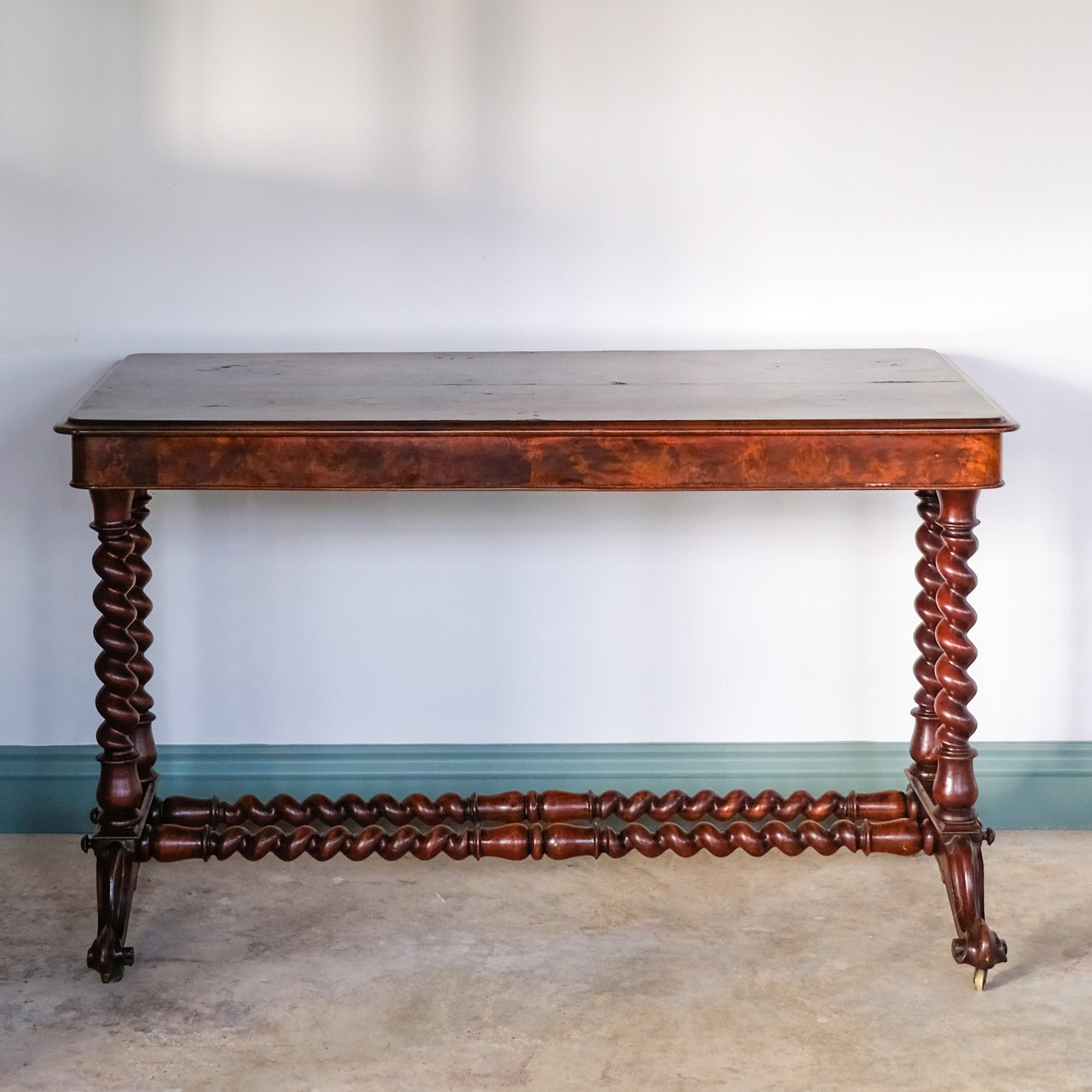 A VICTORIAN WALNUT AND ROSEWOOD LIBRARY TABLE