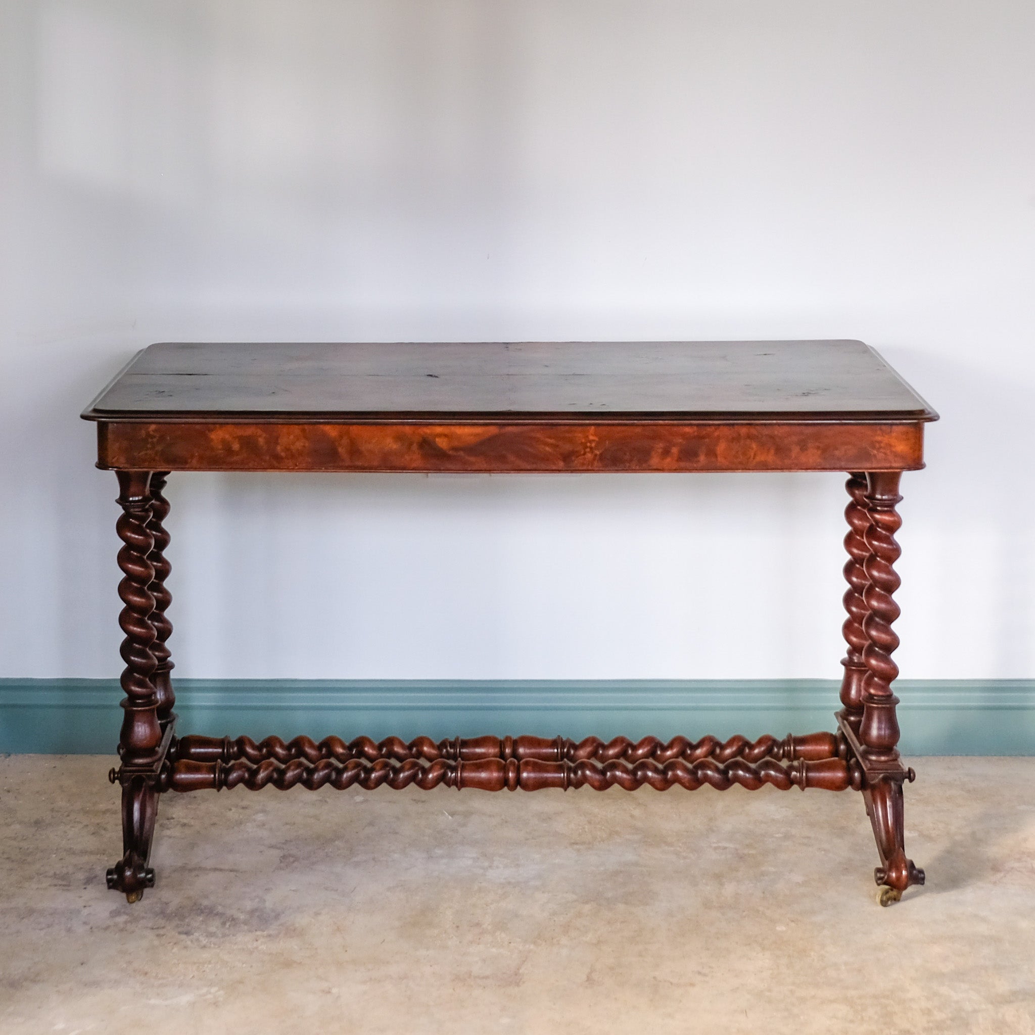 A VICTORIAN WALNUT AND ROSEWOOD LIBRARY TABLE