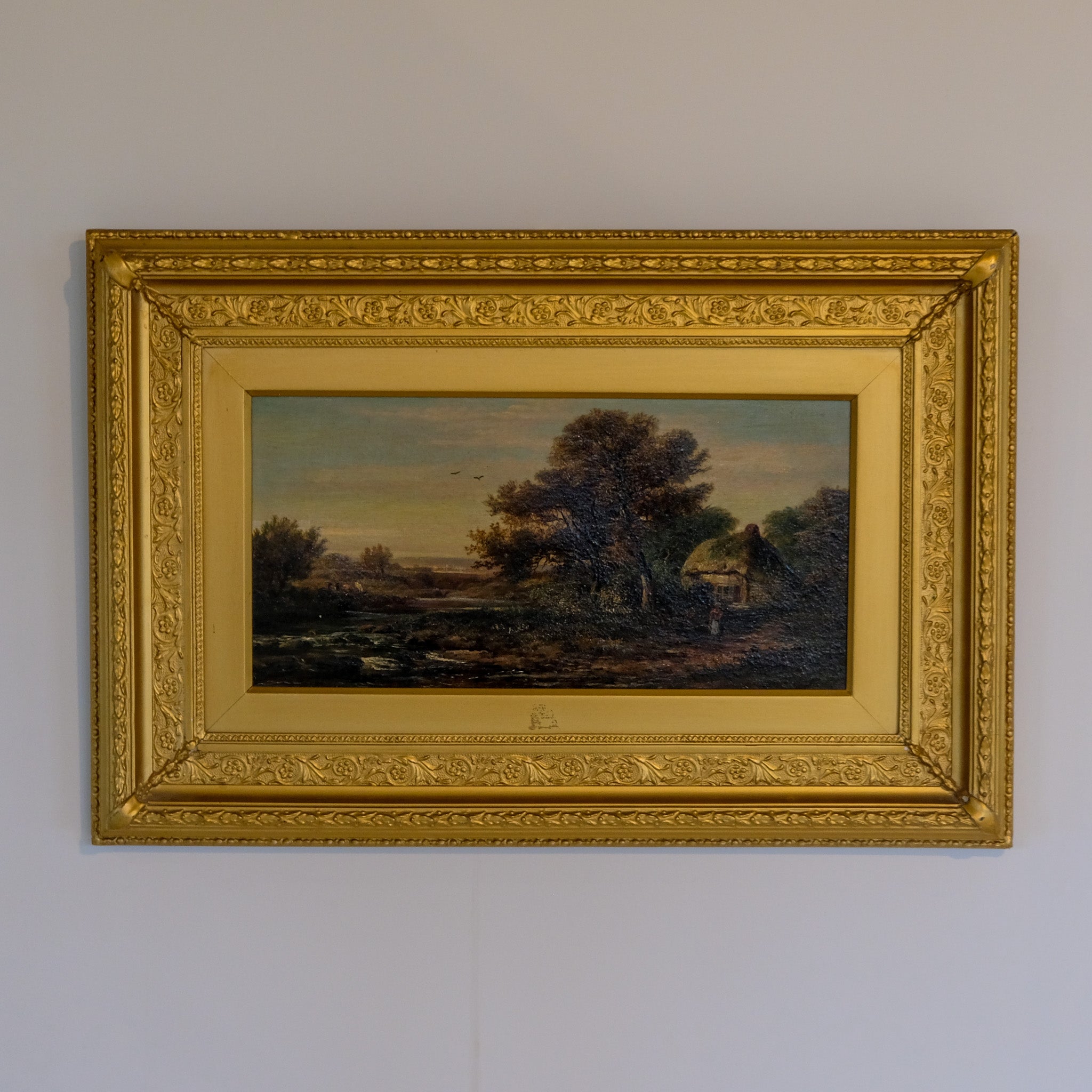 LANDSCAPE WITH A FIGURE BY A THATCHED COTTAGE BY JOHN WESTALL