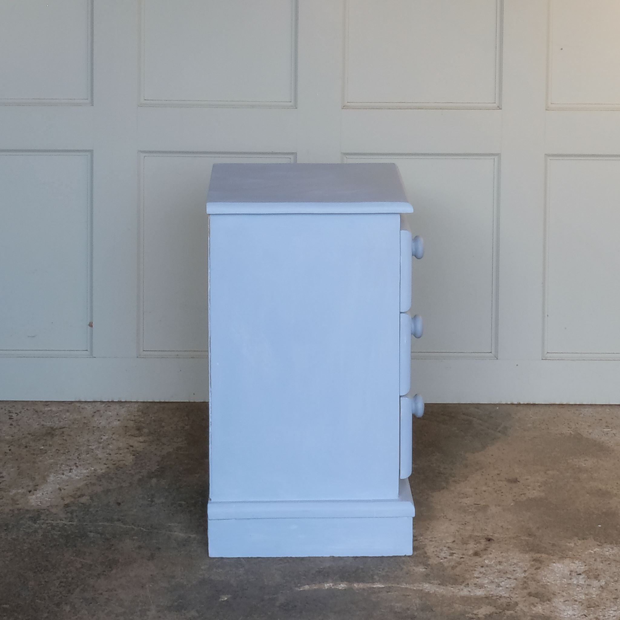 Side angle of Small hand painted blue vintage chest of drawers or bedside table by Summerfield & Scott