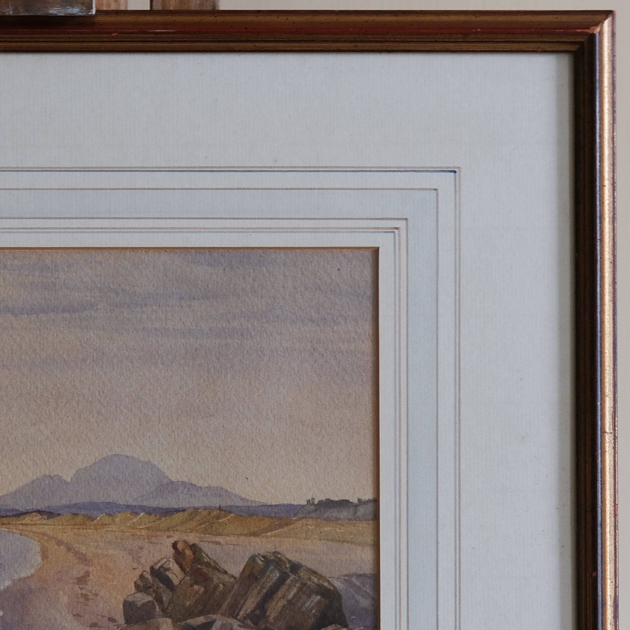 COASTAL LANDSCAPE WITH MOUNTAINS IN THE DISTANCE