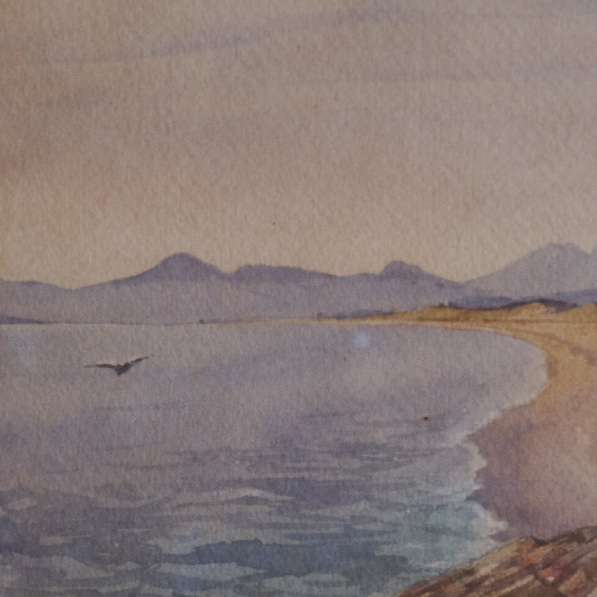 COASTAL LANDSCAPE WITH MOUNTAINS IN THE DISTANCE