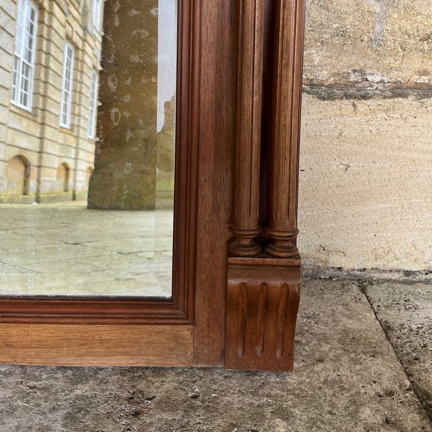 A 19th century pier mirror with original mercury plate in very good condition, some foxing giving a pleasing patina. Flanked on either side by two fluted columns, with detailed carving above.