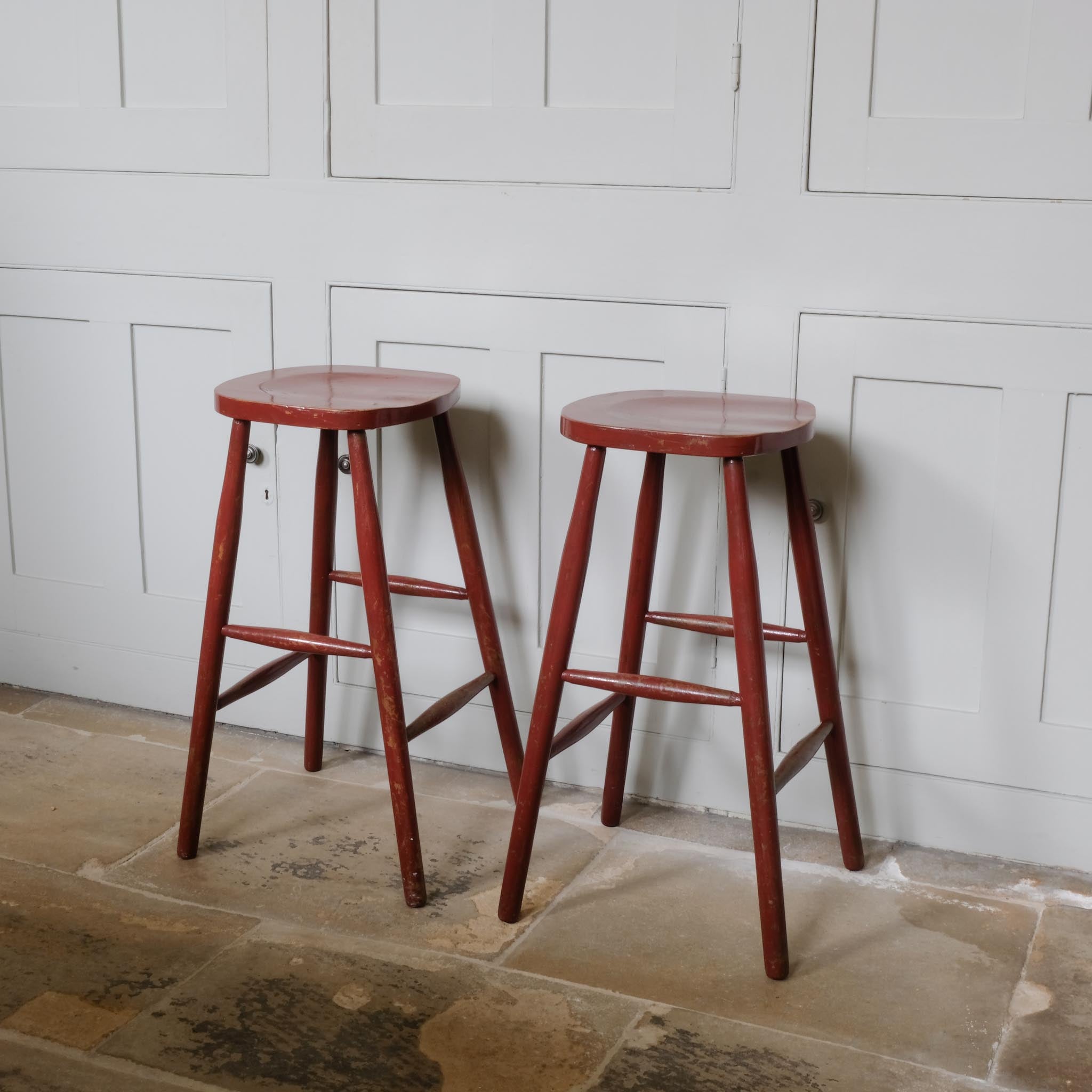 A PAIR OF PAINTED BAR STOOLS