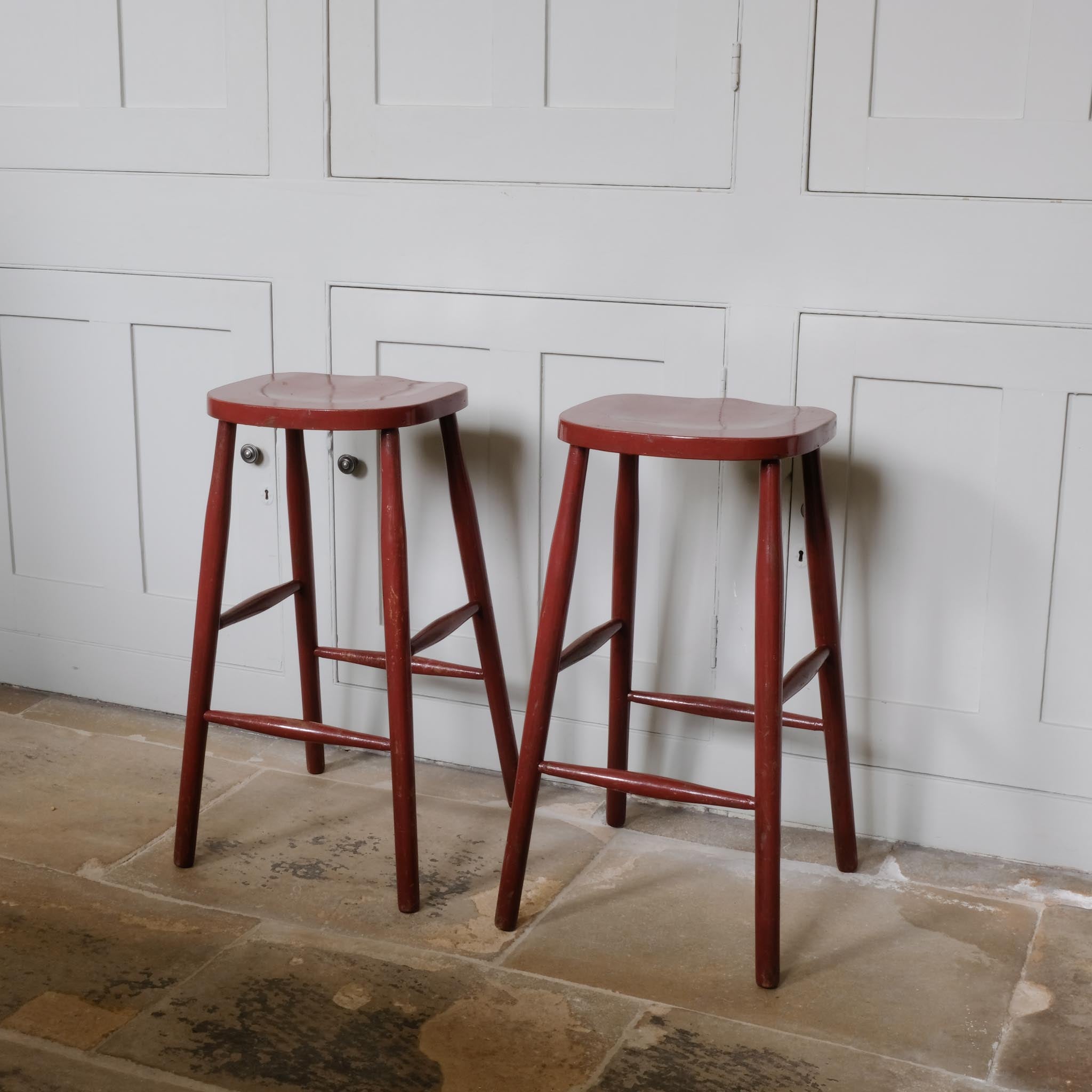 A PAIR OF PAINTED BAR STOOLS