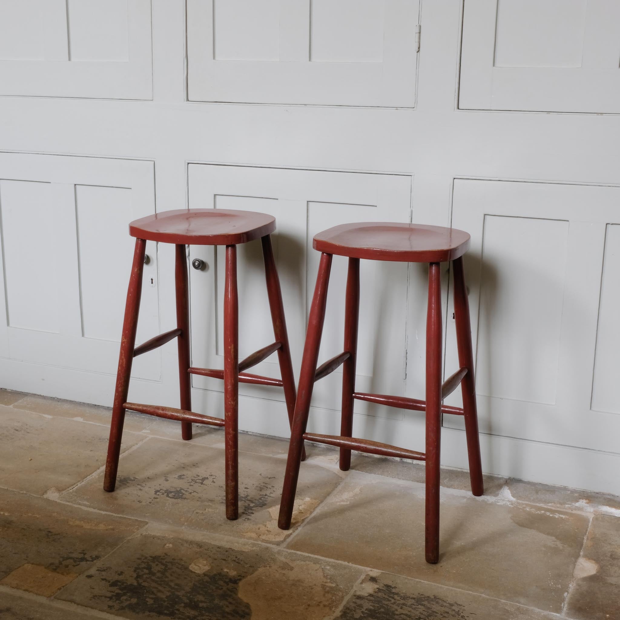 A PAIR OF PAINTED BAR STOOLS