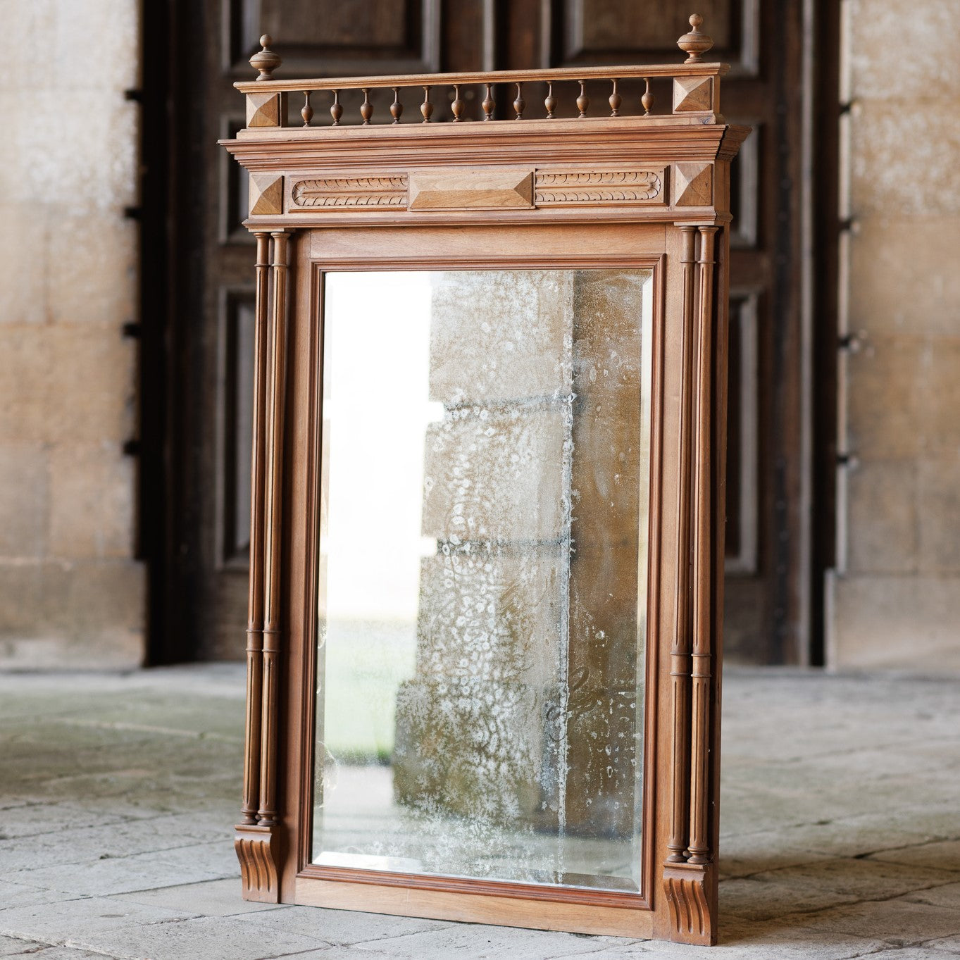 A 19th century pier mirror with original mercury plate in very good condition, some foxing giving a pleasing patina. Flanked on either side by two fluted columns, with detailed carving above.
