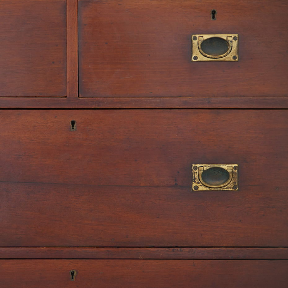 A beautiful brass bound mahogany campaign chest, early 19th century, comprised of two sections with two short over three long drawers with recessed brass handles on the drawers and sides, with a gentle patina commensurate with its age and use, the drawers in excellent working condition. Splits into two for easy manoeuvre. It would make a distinctive and attractive addition to a bedroom or hallway.