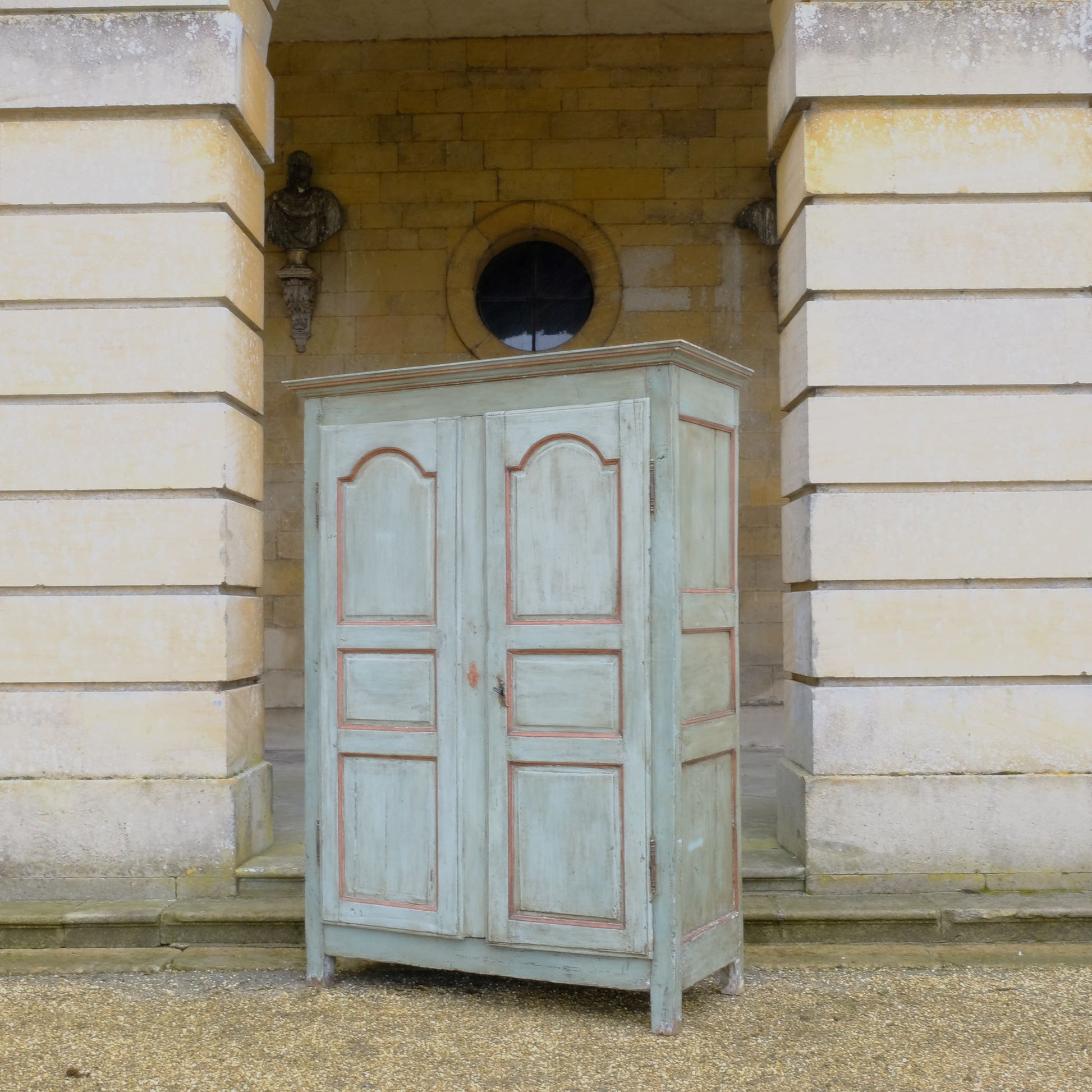 A large 19th century French light blue/green painted cupboard. A moulded cornice above panelled doors with decorative iron hinges and single escutcheon with key. A beautiful colour combination, with a charming crackled patina throughout. Fitted with new slatted shelving to the interior, would make great use as pantry or housekeeper's cupboard.