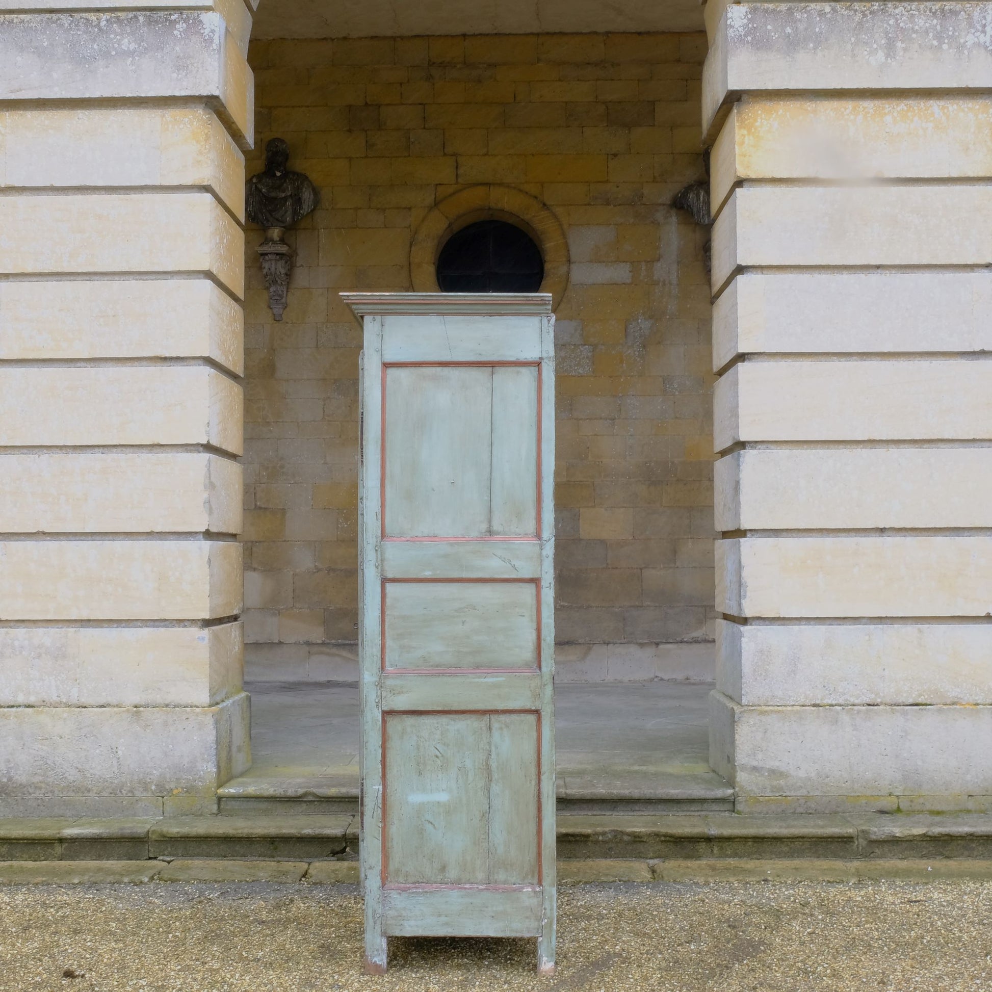 A large 19th century French light blue/green painted cupboard. A moulded cornice above panelled doors with decorative iron hinges and single escutcheon with key. A beautiful colour combination, with a charming crackled patina throughout. Fitted with new slatted shelving to the interior, would make great use as pantry or housekeeper's cupboard.