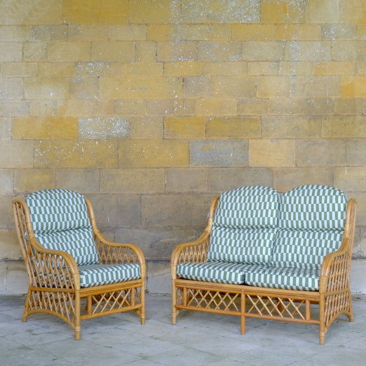 Bamboo cane armchair and sofa with upholstered cushions