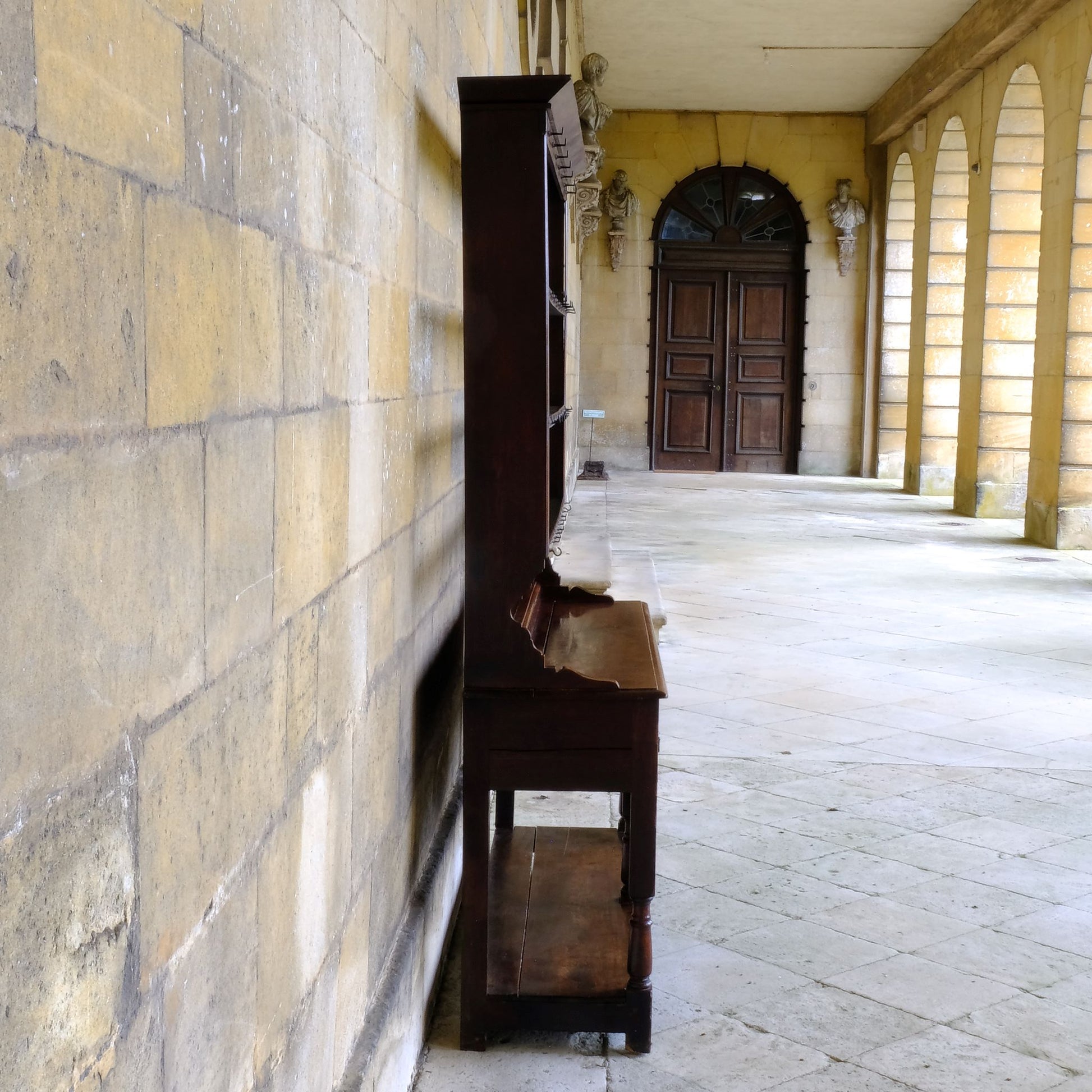 An 18th century dresser in a beautiful rich oak, with open plate shelves over a two drawer base with a twin arched apron on turned legs with a boarded lower shelf. Various hooks along the three shelves and top. Comes in two pieces for easy transport and maneuver. A delightful patina commensurate with age throughout, with some faint signs of an old green tint to the top of the shelves. In very good solid structural condition.