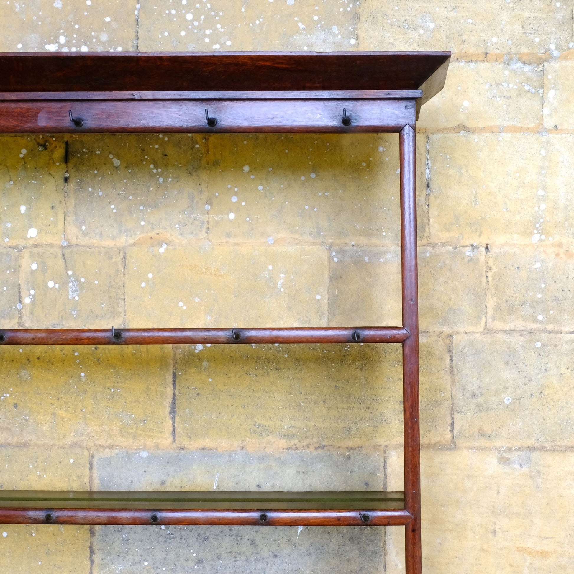 An 18th century dresser in a beautiful rich oak, with open plate shelves over a two drawer base with a twin arched apron on turned legs with a boarded lower shelf. Various hooks along the three shelves and top. Comes in two pieces for easy transport and maneuver. A delightful patina commensurate with age throughout, with some faint signs of an old green tint to the top of the shelves. In very good solid structural condition.