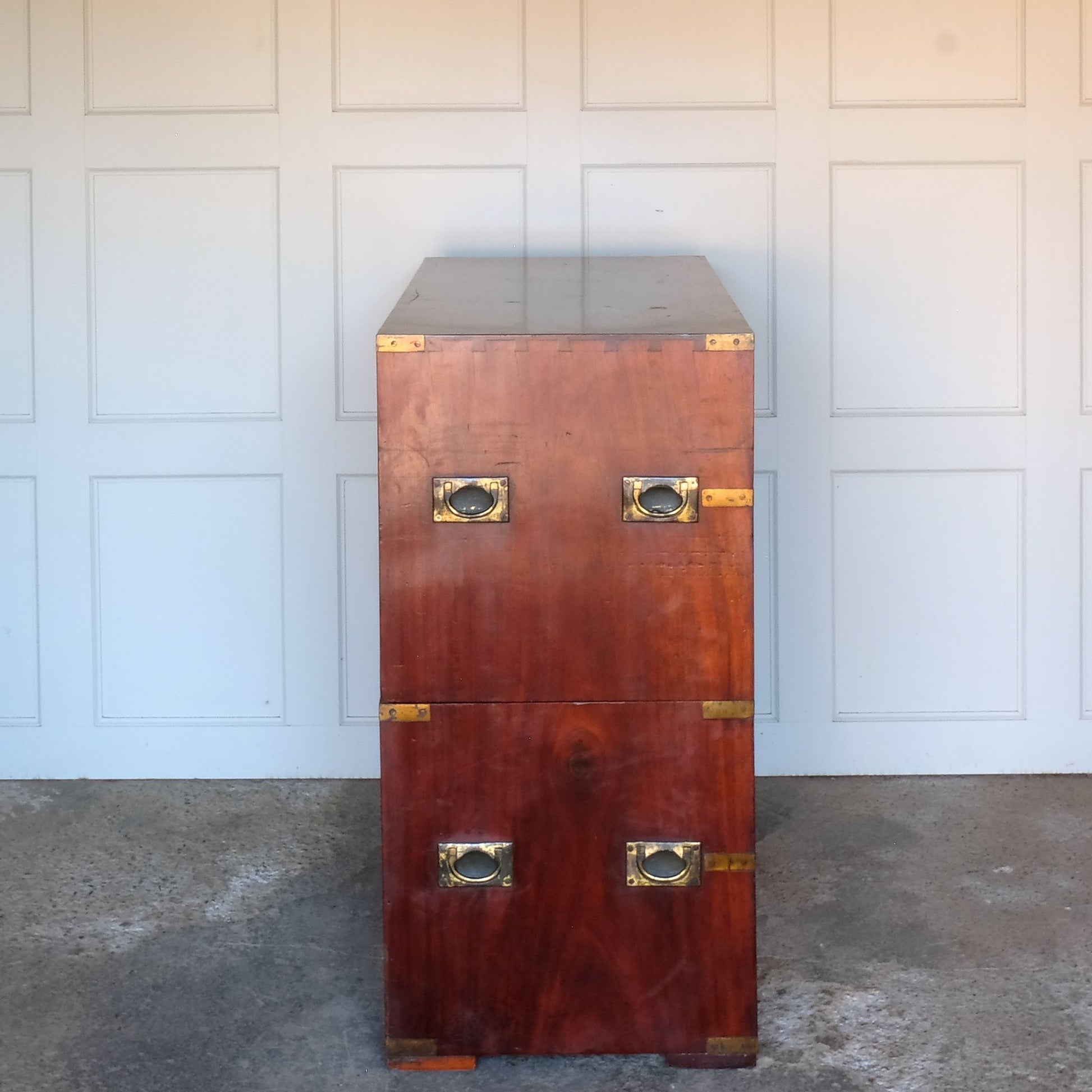 A beautiful brass bound mahogany campaign chest, early 19th century, comprised of two sections with two short over three long drawers with recessed brass handles on the drawers and sides, with a gentle patina commensurate with its age and use, the drawers in excellent working condition. Splits into two for easy manoeuvre. It would make a distinctive and attractive addition to a bedroom or hallway.