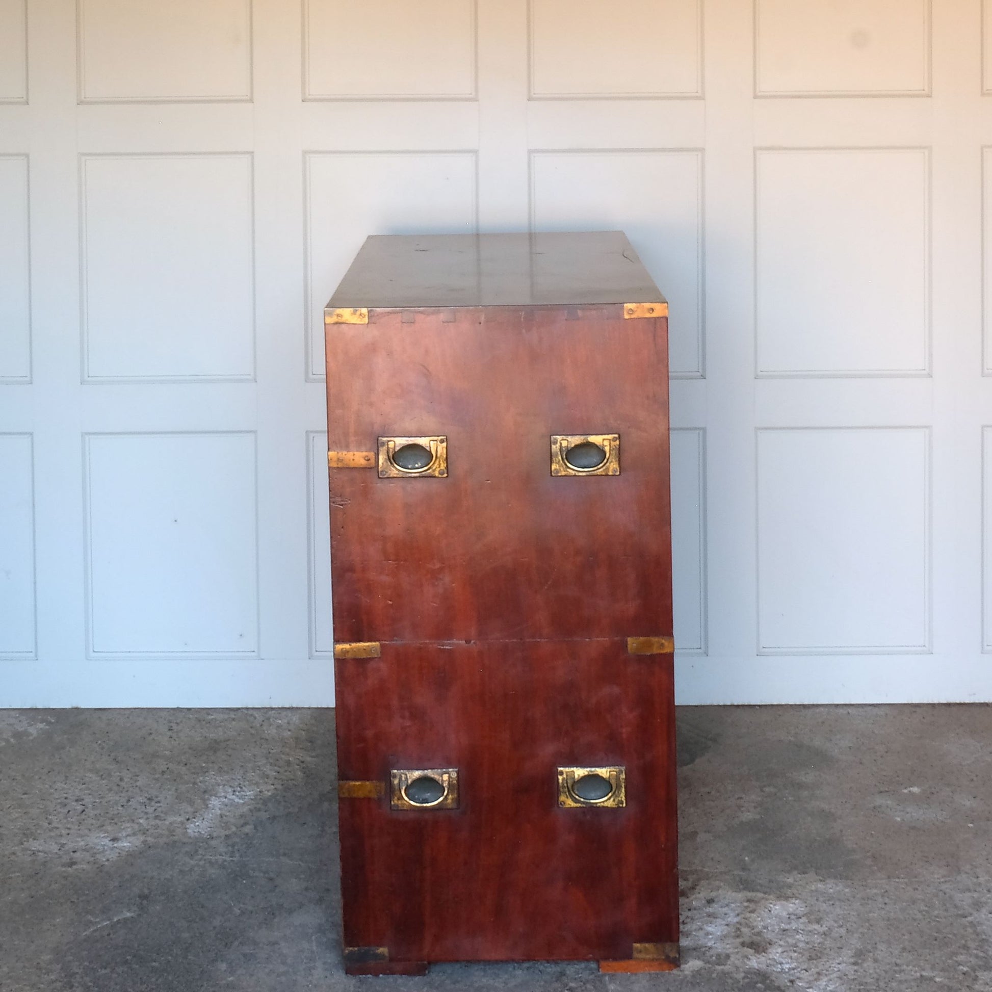 A beautiful brass bound mahogany campaign chest, early 19th century, comprised of two sections with two short over three long drawers with recessed brass handles on the drawers and sides, with a gentle patina commensurate with its age and use, the drawers in excellent working condition. Splits into two for easy manoeuvre. It would make a distinctive and attractive addition to a bedroom or hallway.