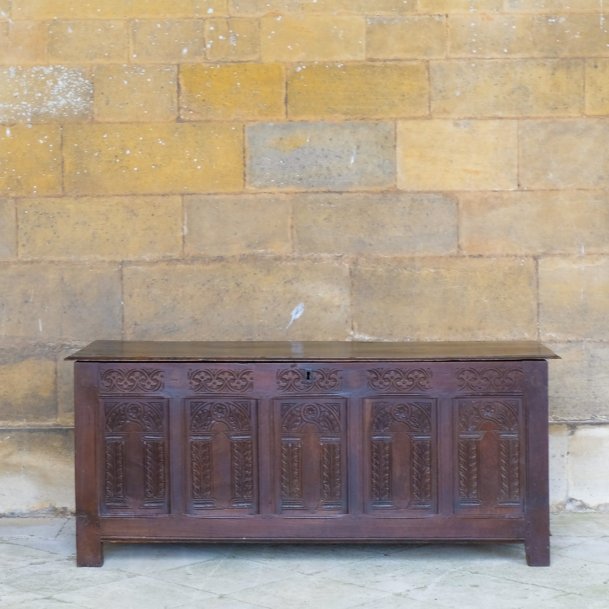 A large 17th century oak coffer with a beautiful five panelled front 