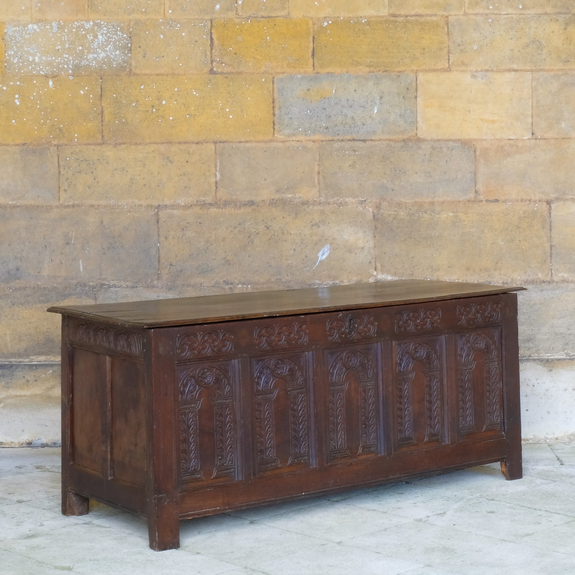 A large 17th century oak coffer with a beautiful five panelled front 