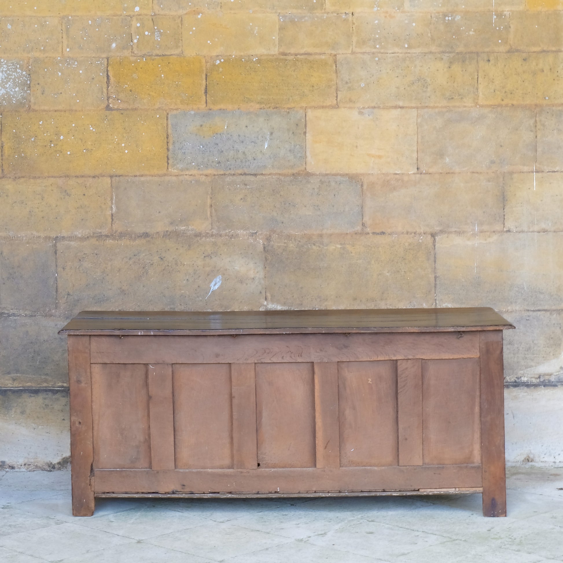 A large 17th century oak coffer with a beautiful five panelled front