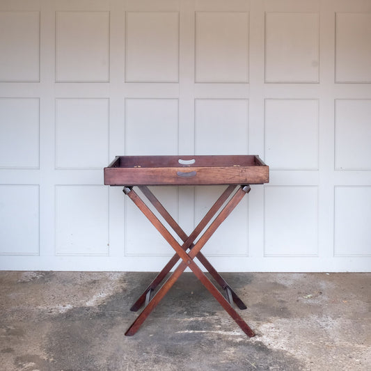 A generously sized mahogany butlers tray on stand, 19th century, the tray with four handles and hinged sides on a square section folding stand. In good and study condition.