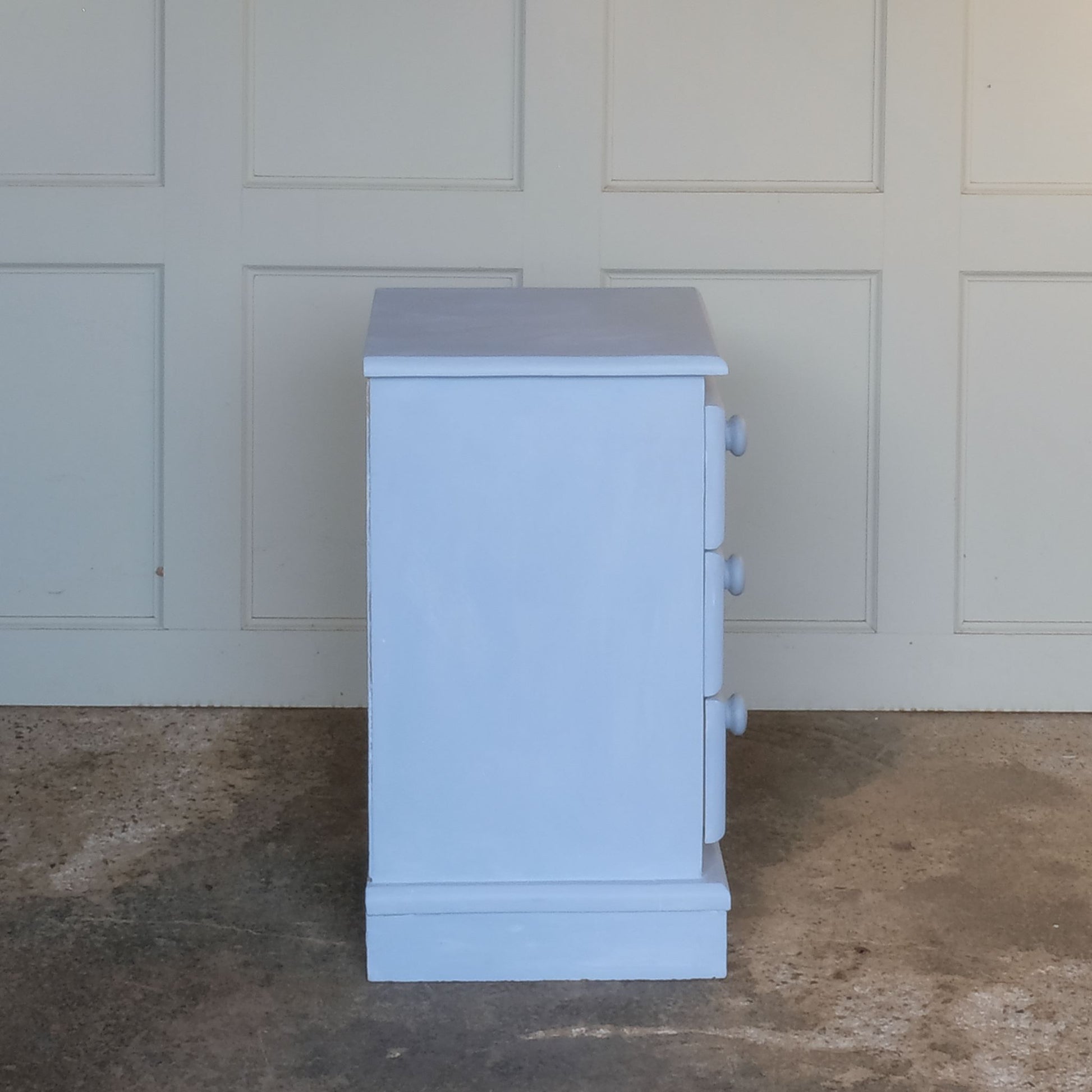 Side angle of Small hand painted blue vintage chest of drawers or bedside table by Summerfield & Scott