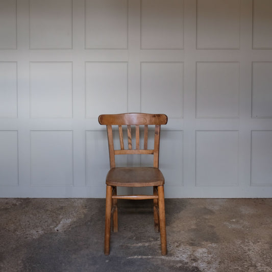 A classic school chair design, of adult size, made from hard-wearing and durable solid wood. With signs of life, cleaned and waxed, in good, sturdy condition.