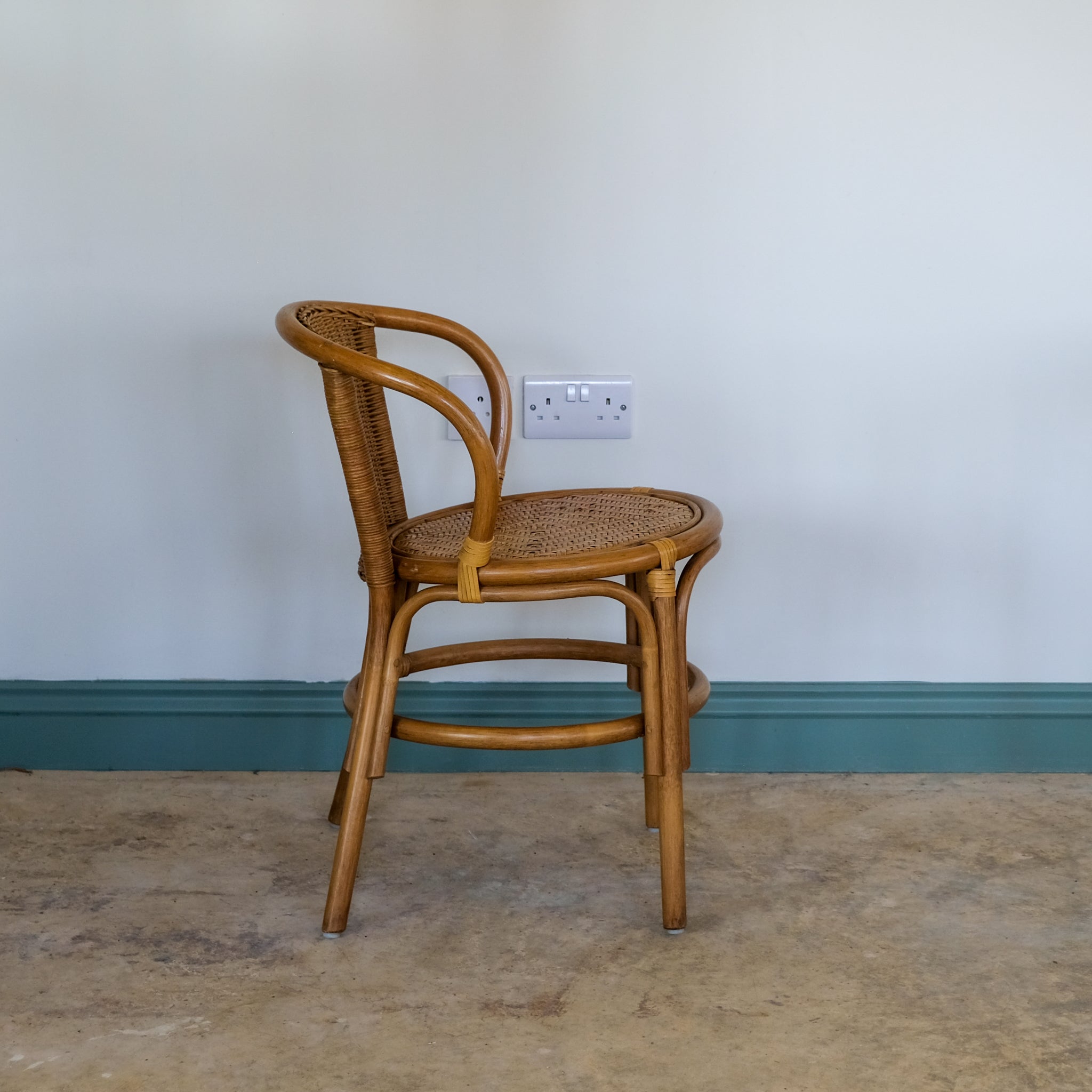 SMALL RATTAN BENTWOOD ARMCHAIR