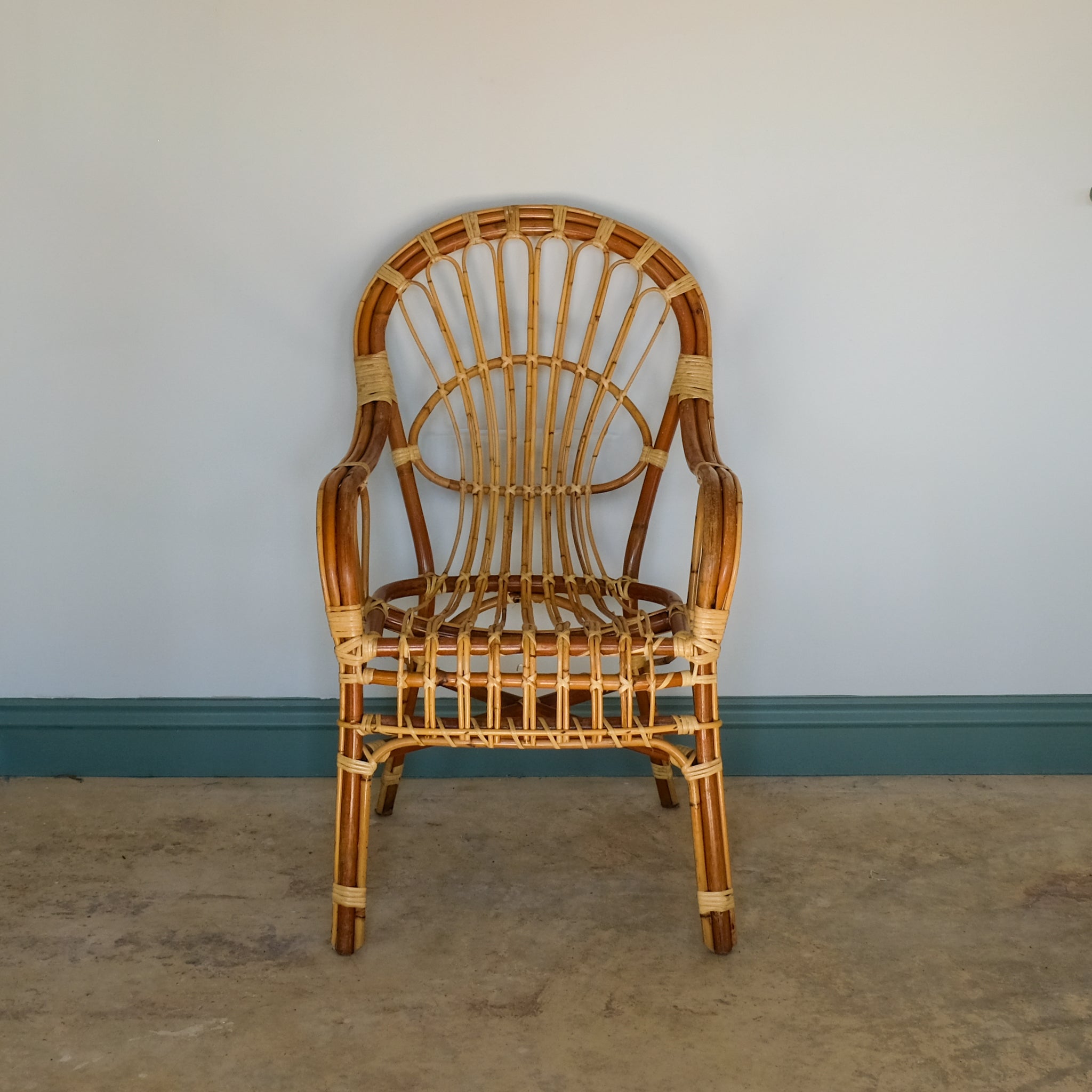 MID CENTURY RATTAN ARMCHAIR