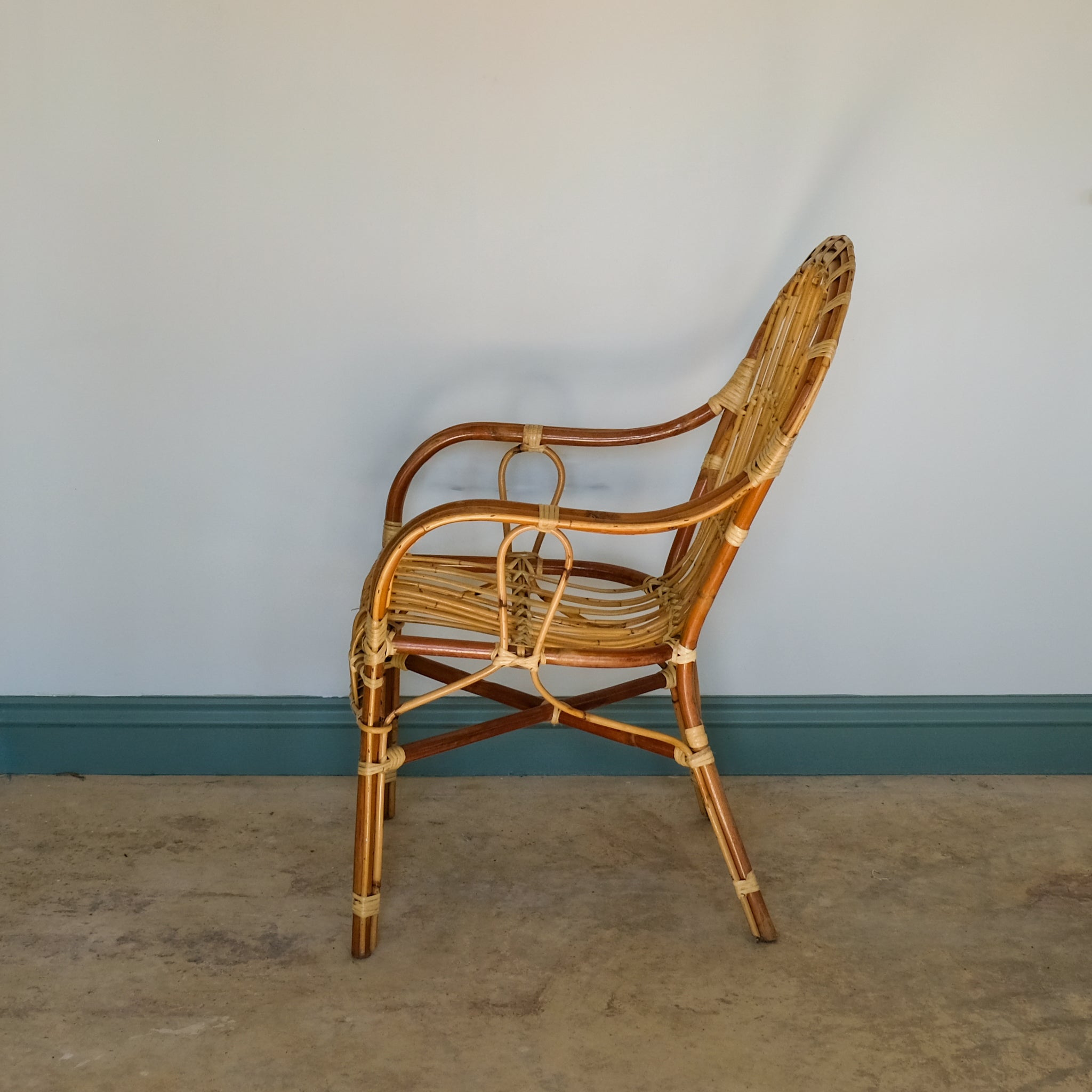 MID CENTURY RATTAN ARMCHAIR