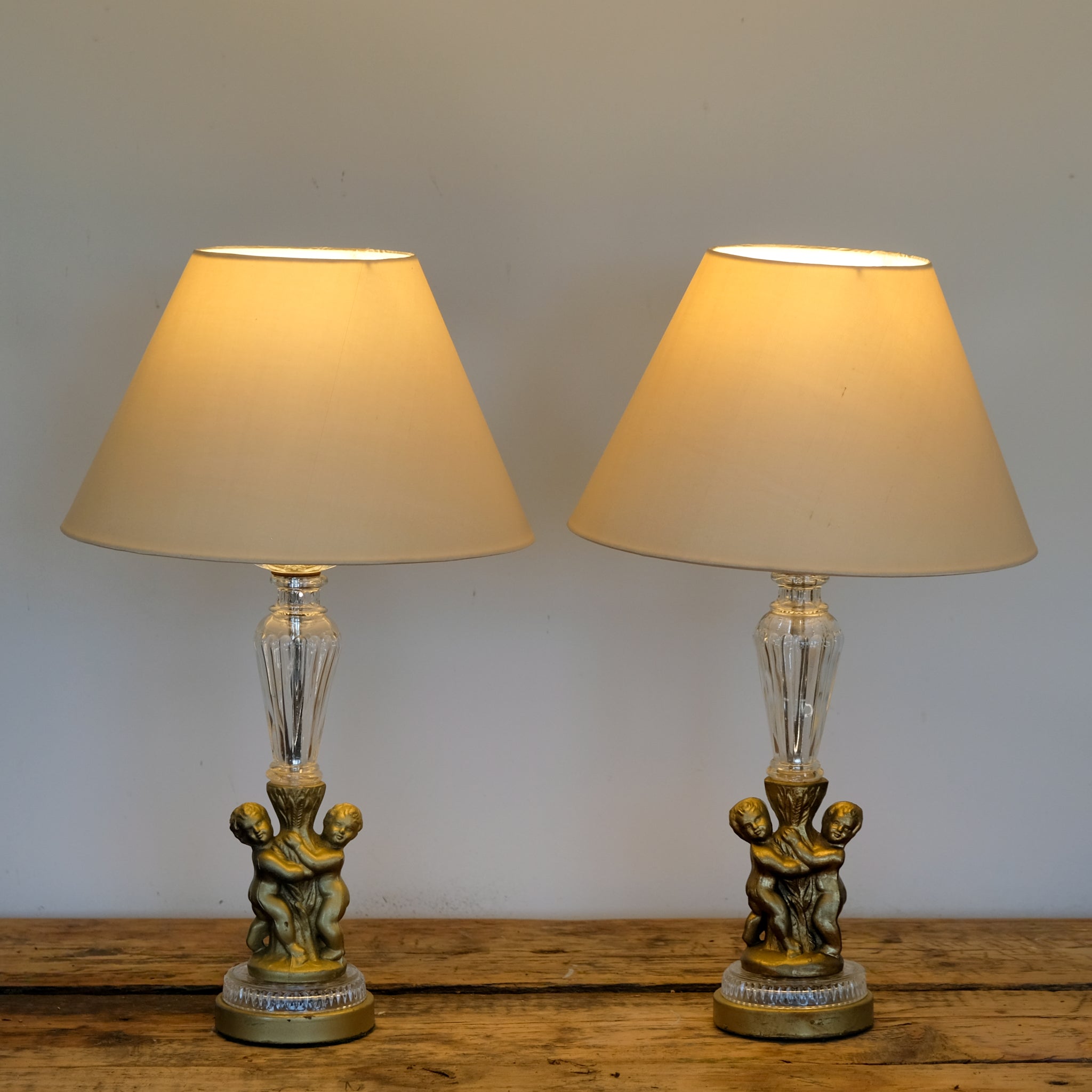 Pair of 1930s Glass and Gilded Cherub Table Lamps
