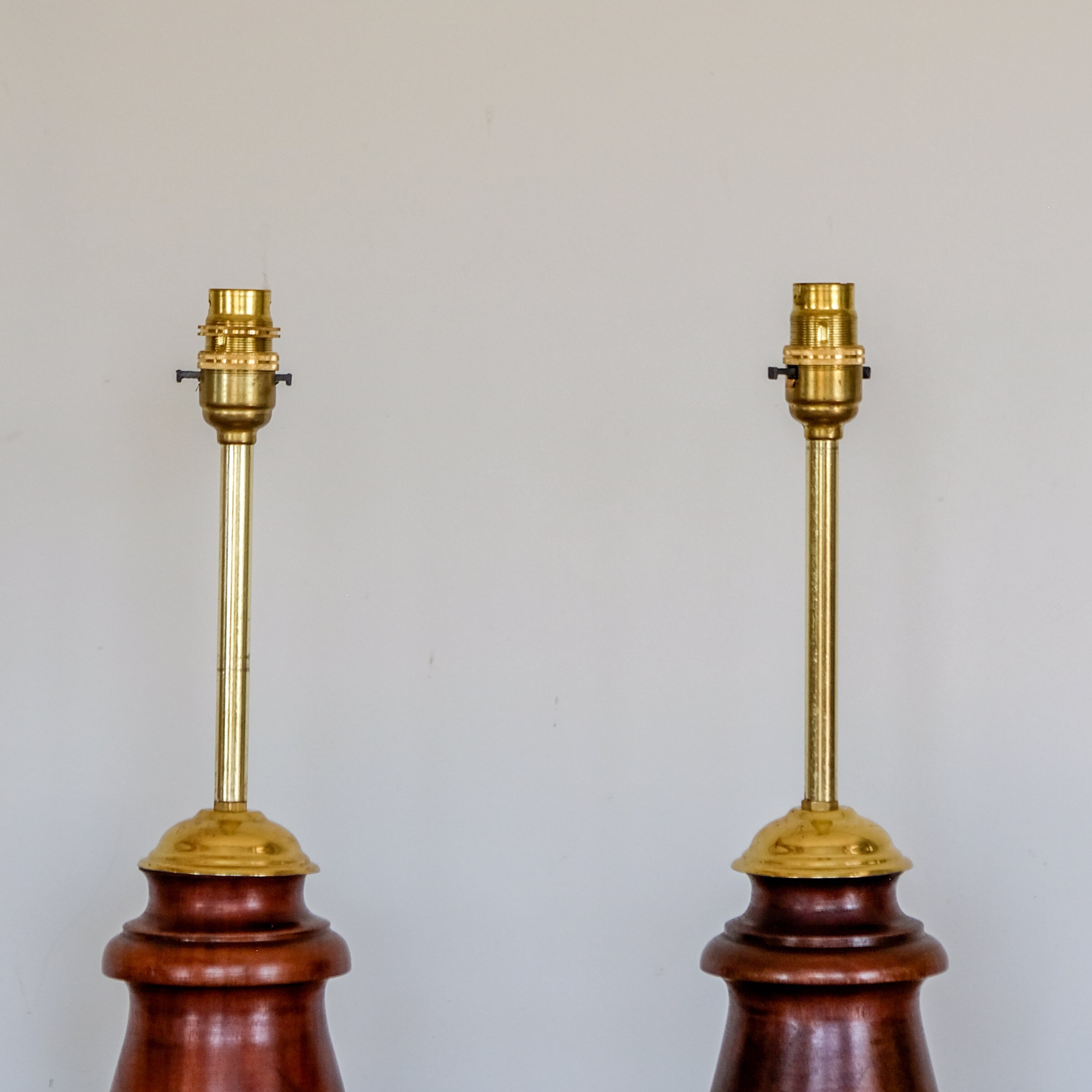 PAIR OF FIGURED HARDWOOD TABLE LAMPS
