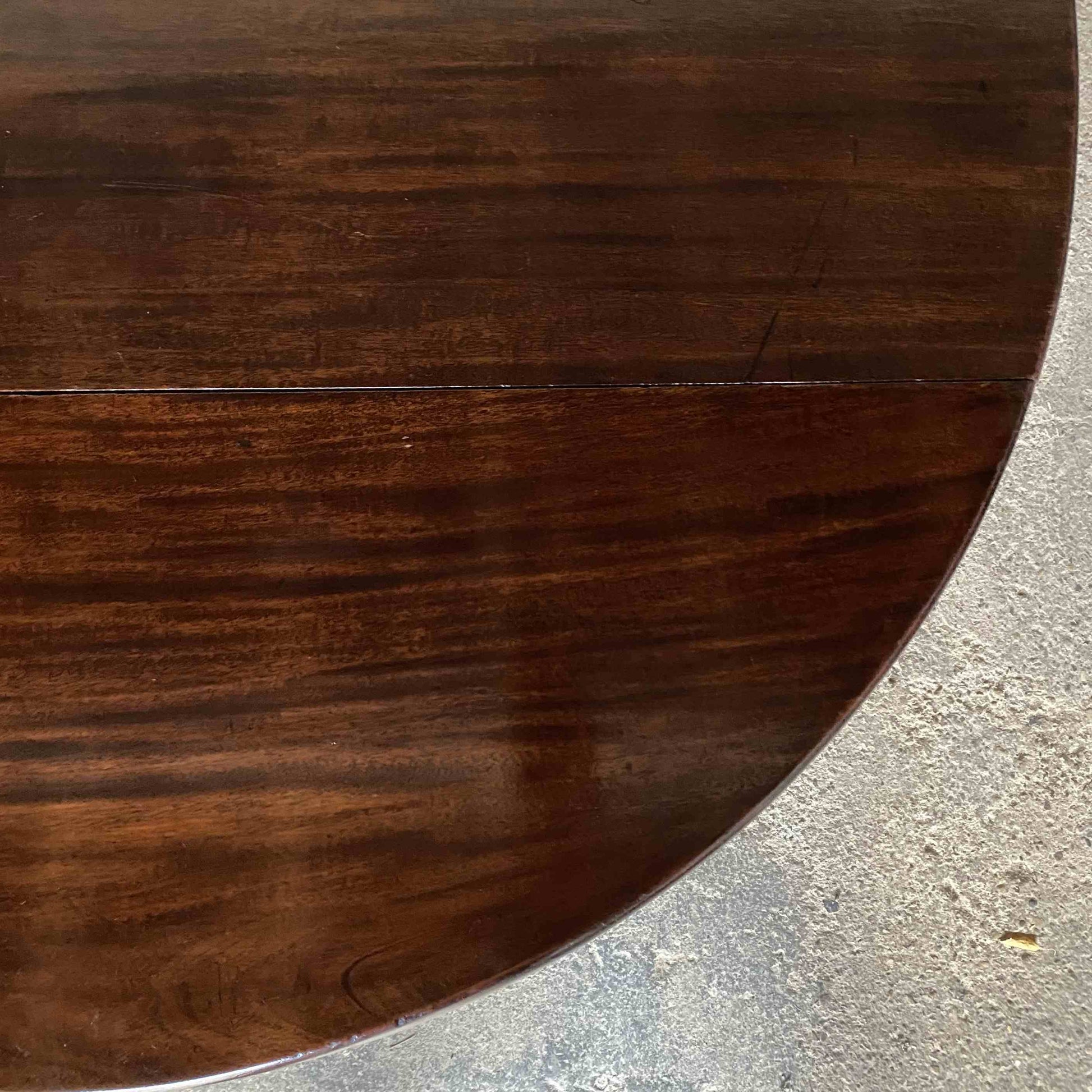 A George III mahogany oval drop leaf table, standing on elegant cabriole legs. A lovely example with a delightful patina throughout in very good condition. Perfect as a dining, side or hall table.