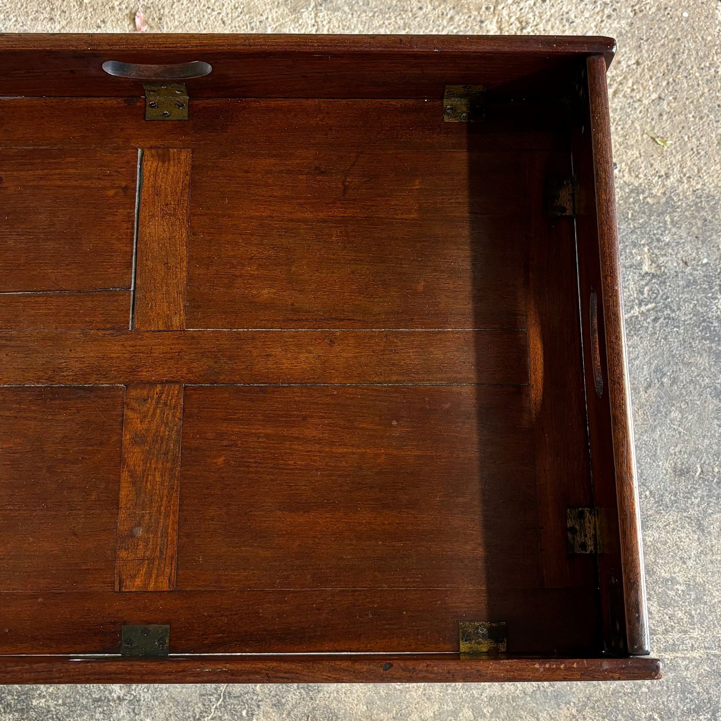 A generously sized mahogany butlers tray on stand, 19th century, the tray with four handles and hinged sides on a square section folding stand. In good and study condition.