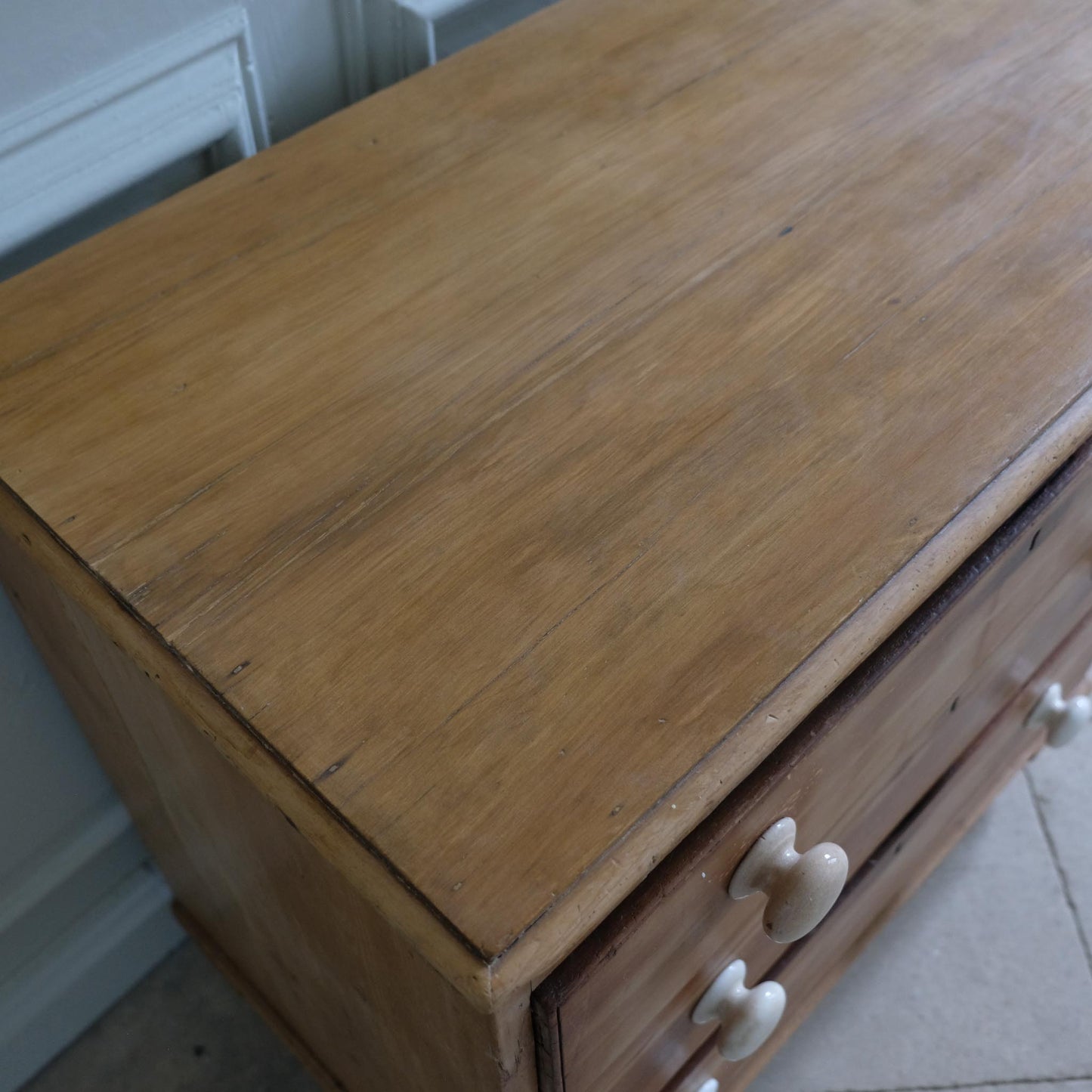 EDWARDIAN PINE CHEST OF DRAWERS WITH CERAMIC HANDLES