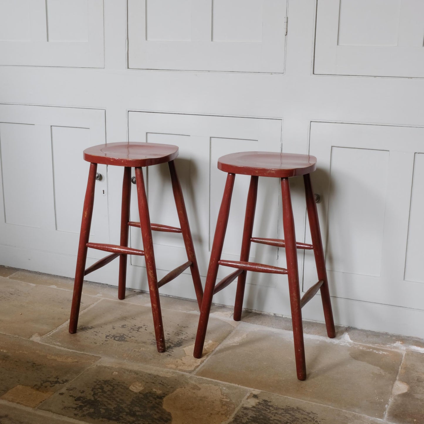 A PAIR OF PAINTED BAR STOOLS