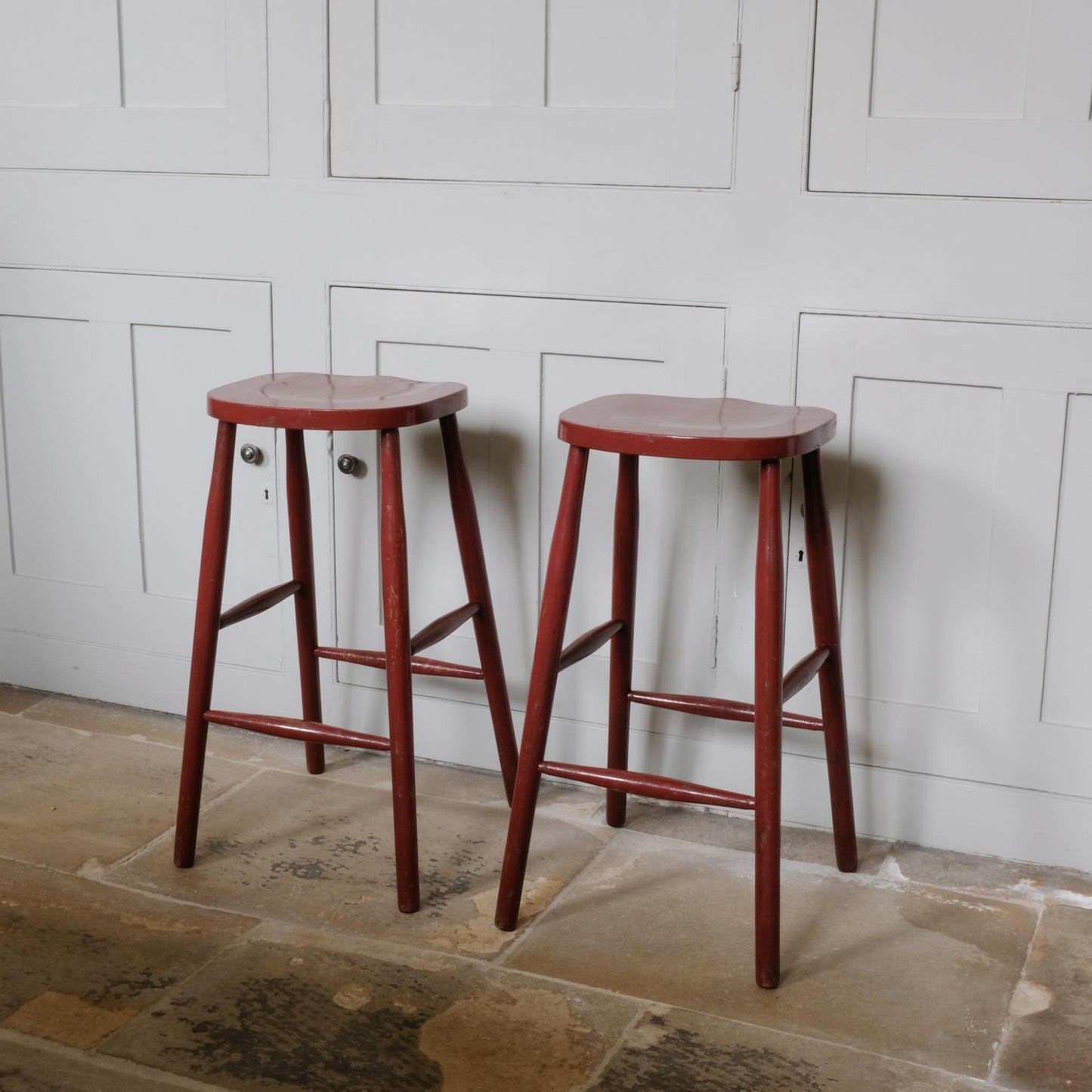 A PAIR OF PAINTED BAR STOOLS