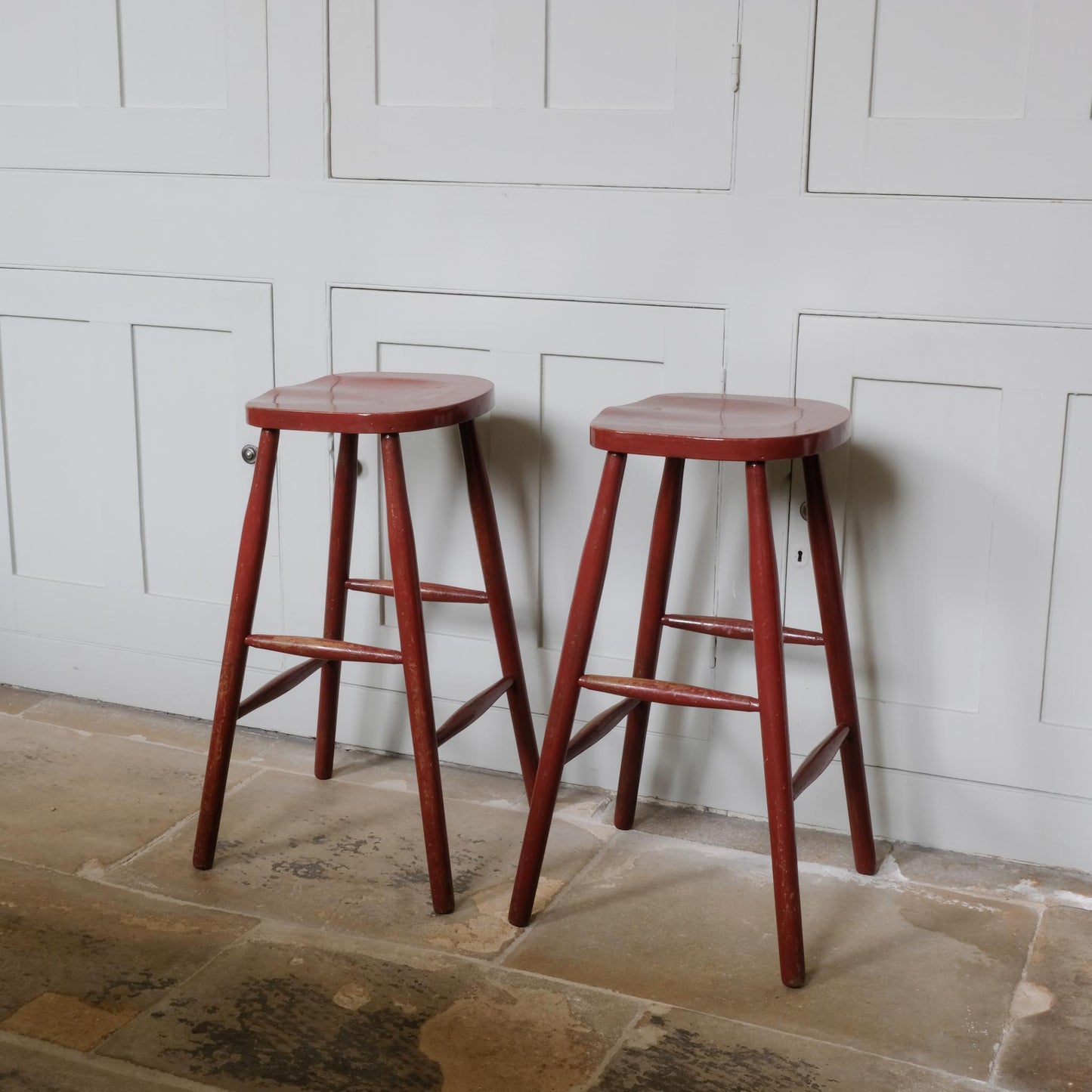A PAIR OF PAINTED BAR STOOLS