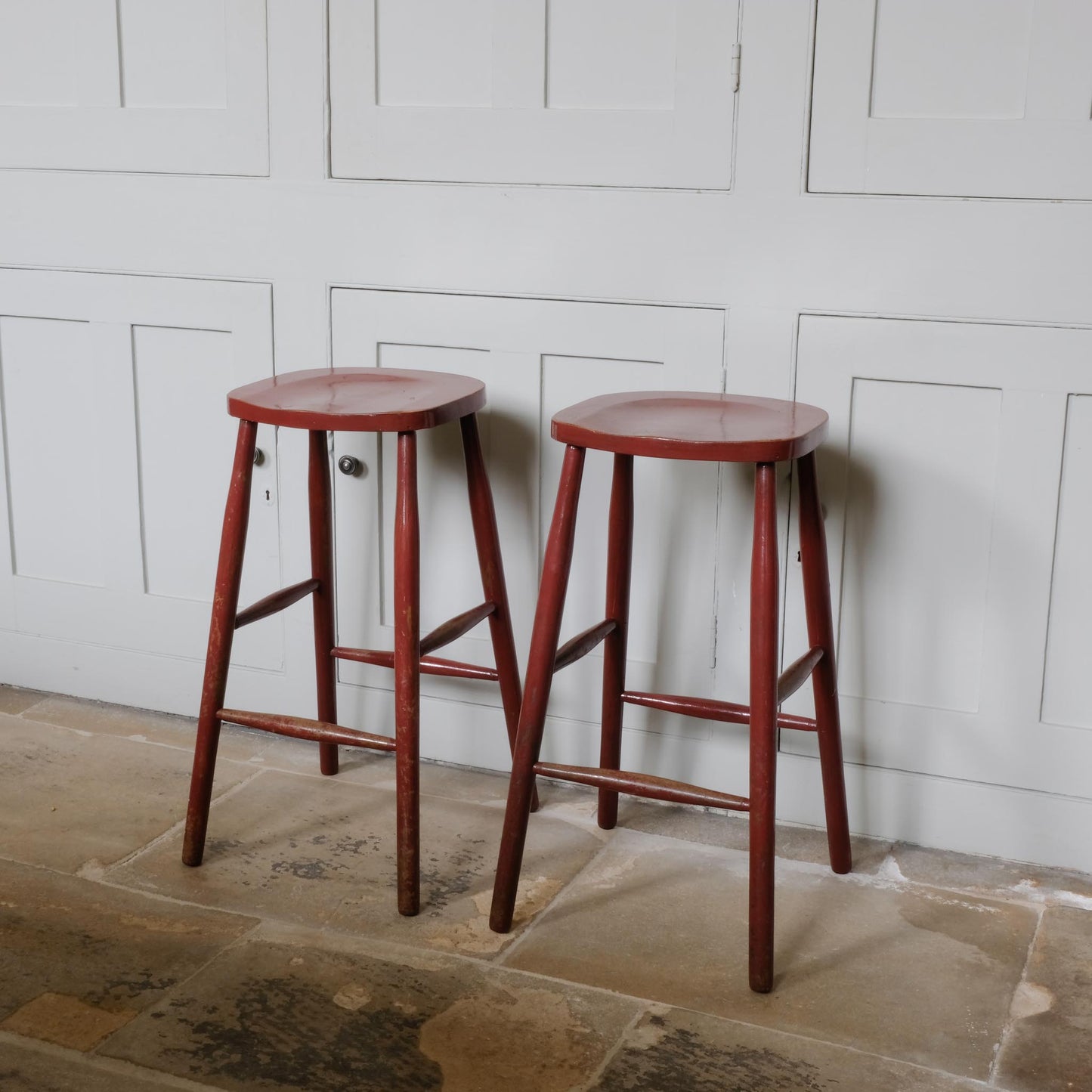 A PAIR OF PAINTED BAR STOOLS