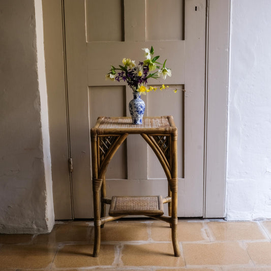 A BAMBOO AND RATTAN SIDE TABLE