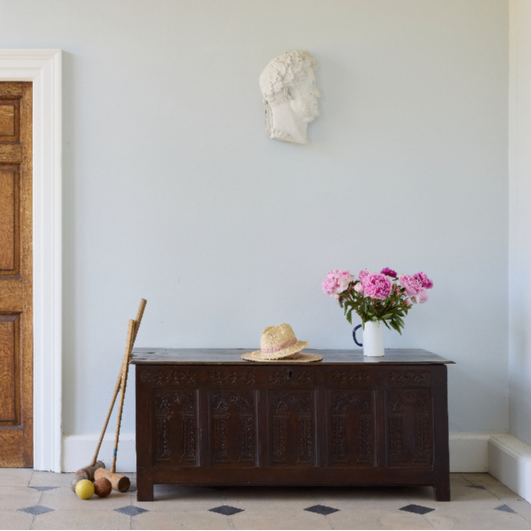 A large 17th century oak coffer with a beautiful five panelled front in situ