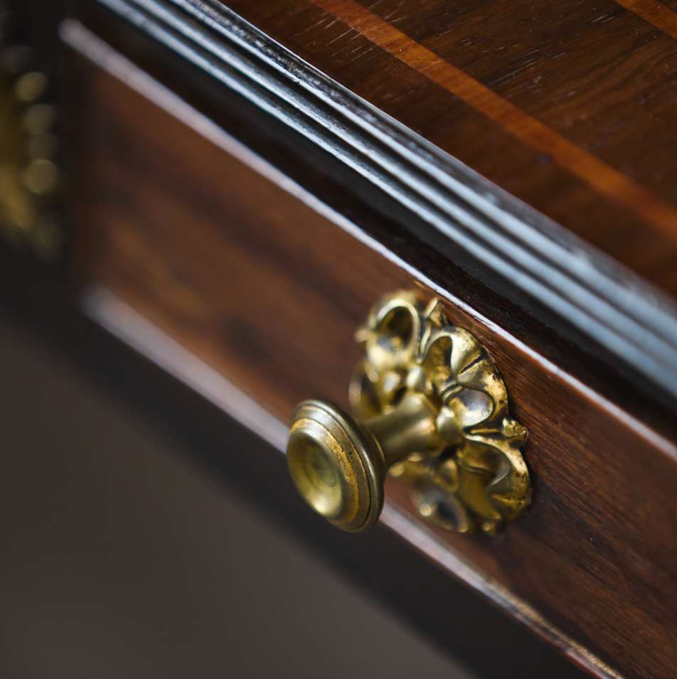 A beautiful and rare Regency rosewood and ebonised sofa table, circa 1820, elegant crossbanding on the top, with two frieze drawers and matching faux drawers to the reverse. Raised on beautiful, ebonised and gilded lyre end supports with a distinctively arched stretcher, on brass castors. A restored scratch to the surface, undertaken by Anthony Beech, in very good condition.