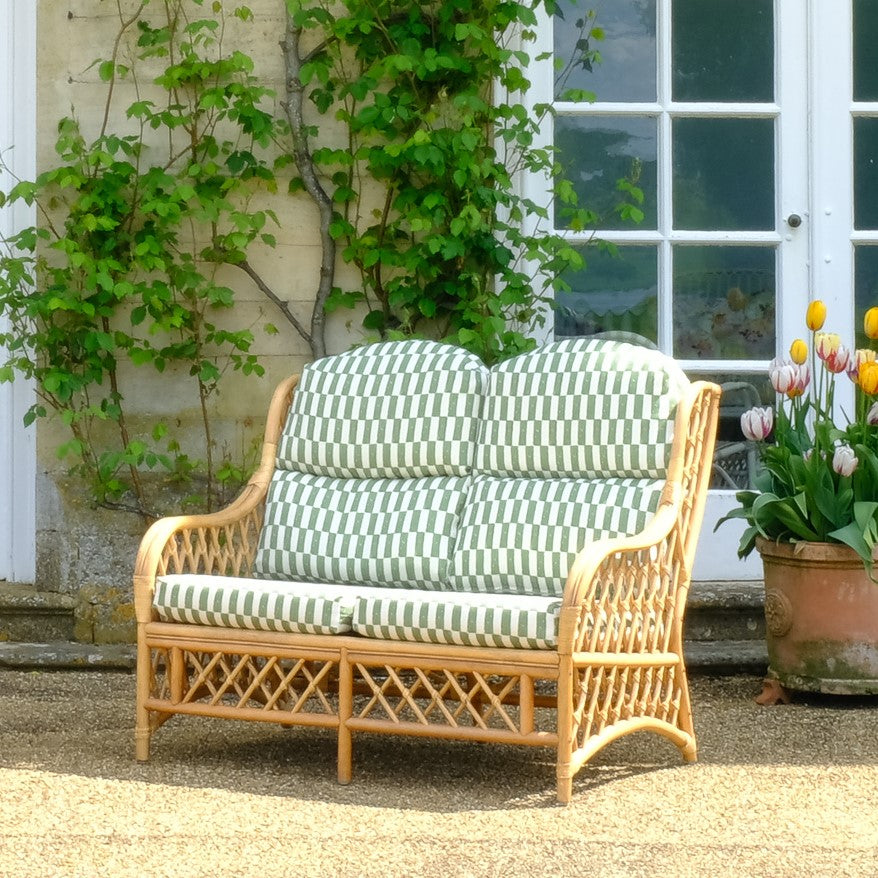 1970's Vintage Cane Bamboo Sofa with Upholstered Seat pad, in situ on patio - Summerfield & Scott