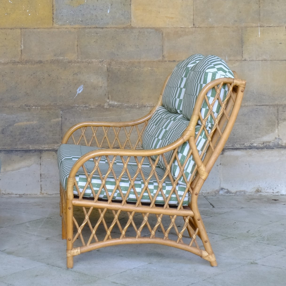 Side angle view of 1970's Vintage Cane Bamboo Sofa with Upholstered Seat pad - Summerfield & Scott