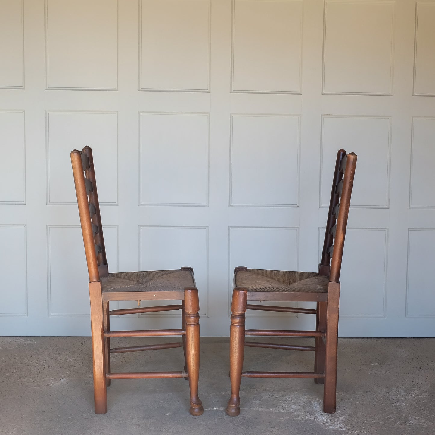 Pair of oak ladder back chairs