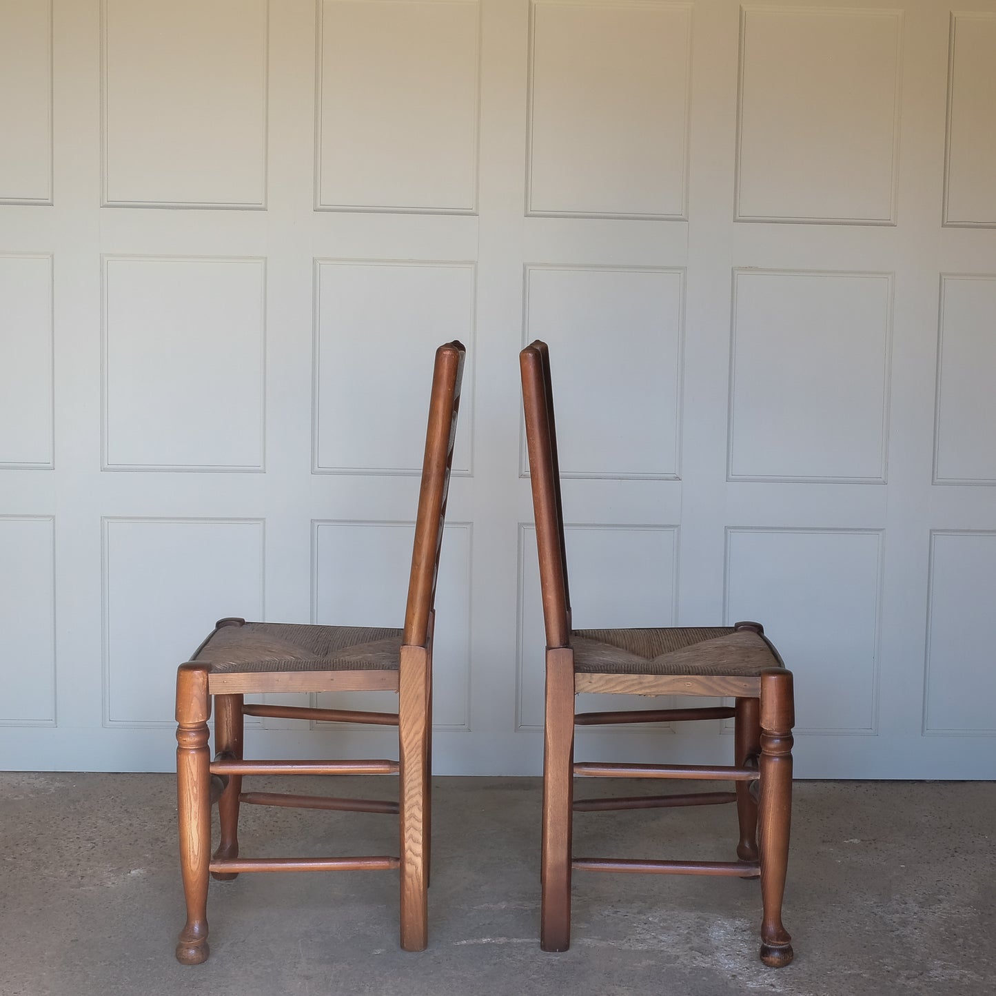 Pair of oak ladder back chairs