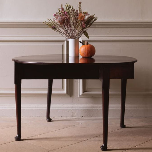A George III mahogany oval drop leaf table, standing on elegant cabriole legs. A lovely example with a delightful patina throughout in very good condition. Perfect as a dining, side or hall table.
